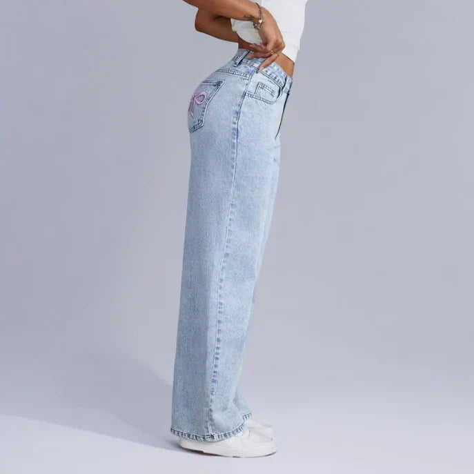 Stijlvolle denim jeans met wijde pijpen en roze strikdetails - Dames