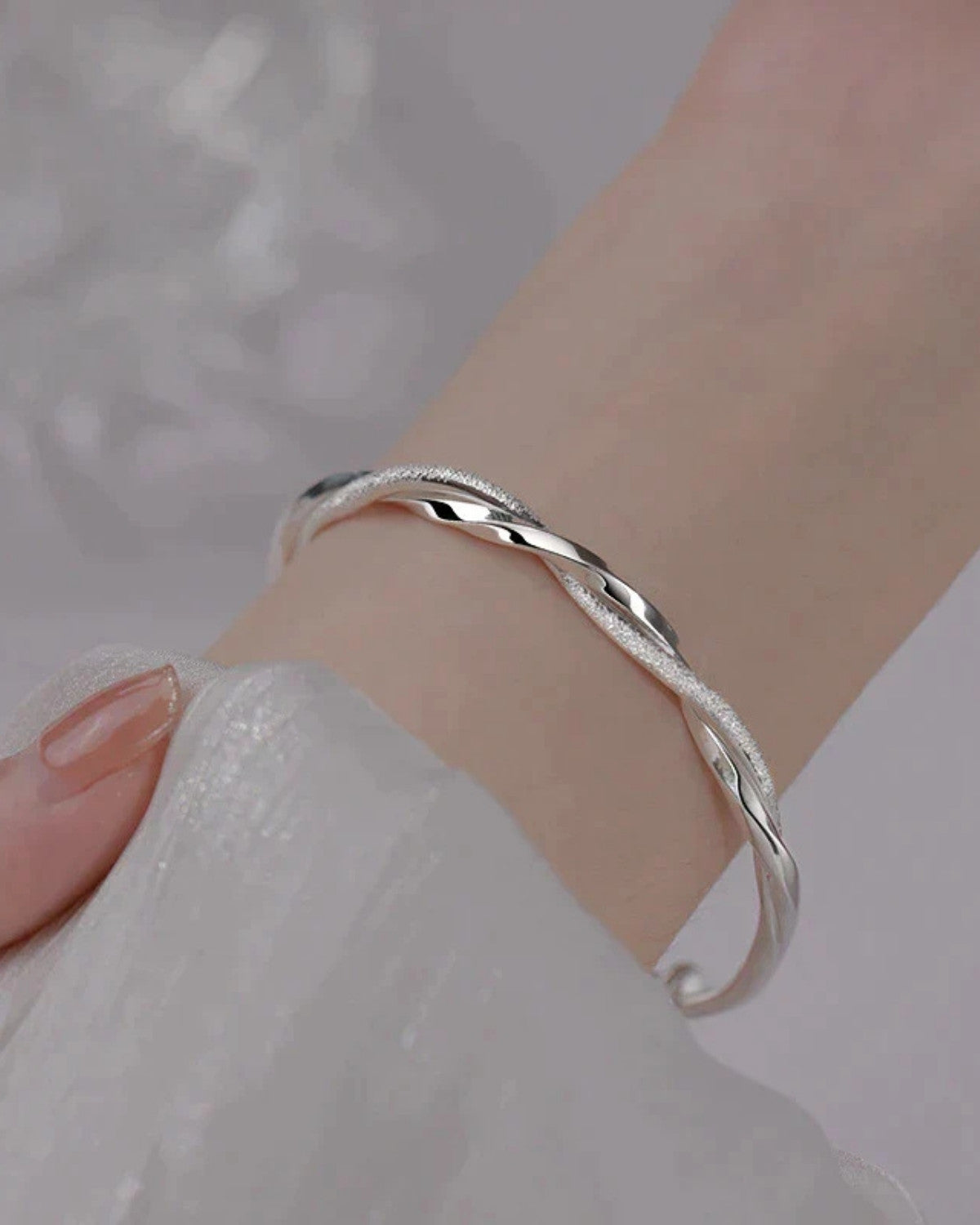 Elegante gedraaide zilveren armband - Dames