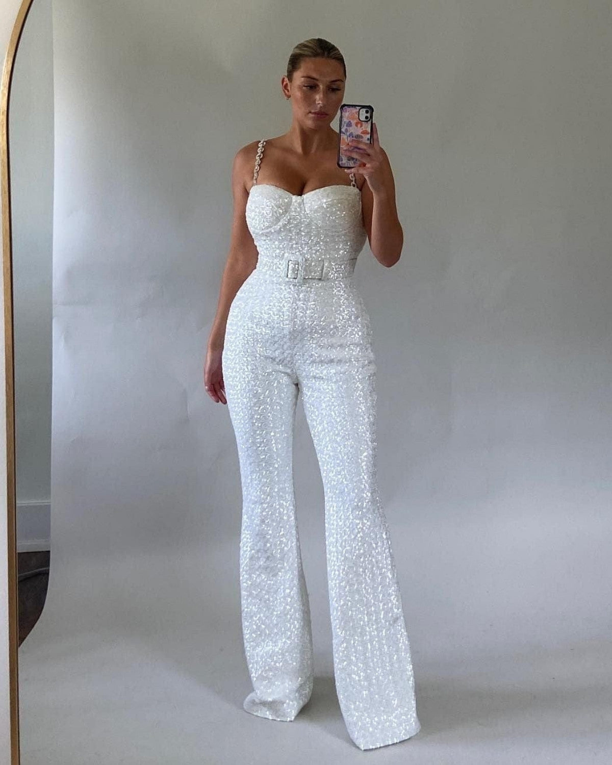 Glinsterende jumpsuit met taille riem van rekbare stof – Dames